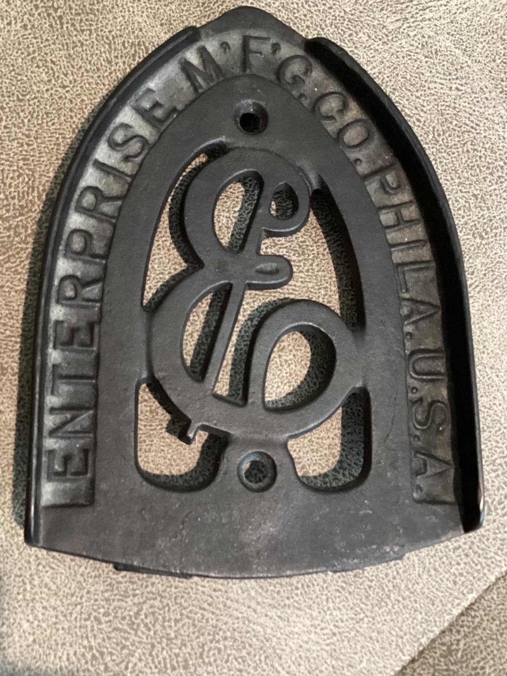 Vintage cast iron trivet by Enterprise MFG company Philadelphia